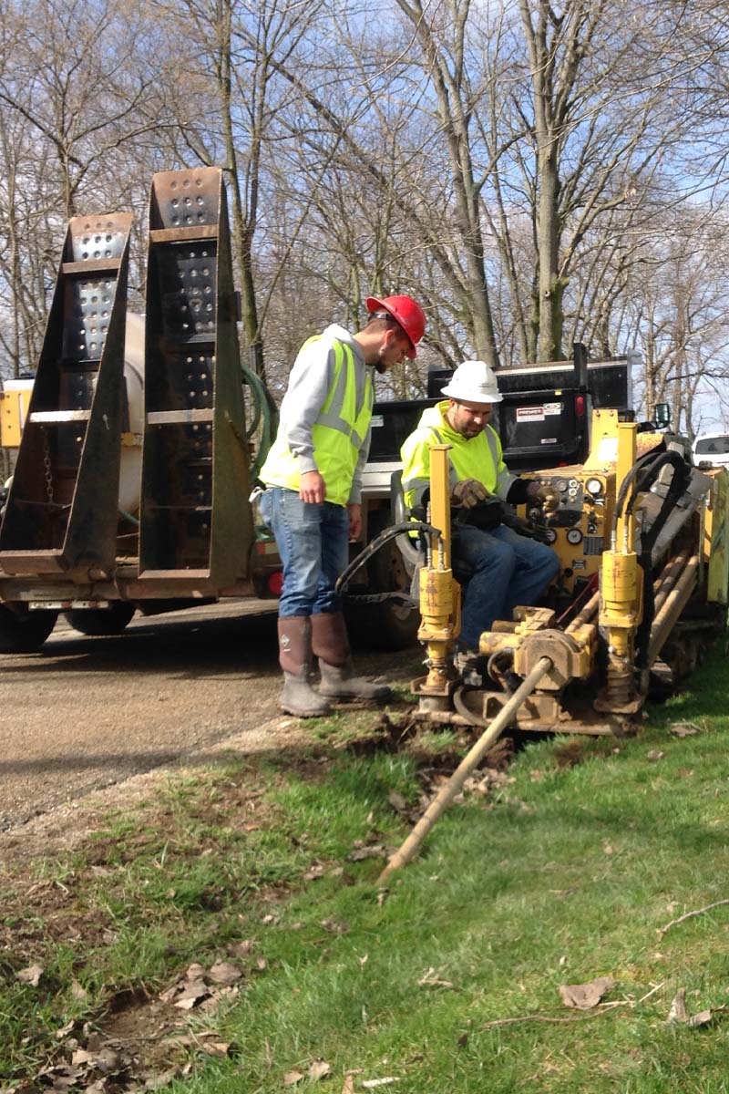 workers and machinery outdoors